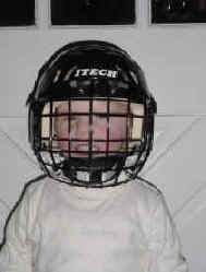 The Ambassador readies himself for the battle on the ice with his best defence: lots of padding.